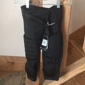 Nike boys football pants with pads